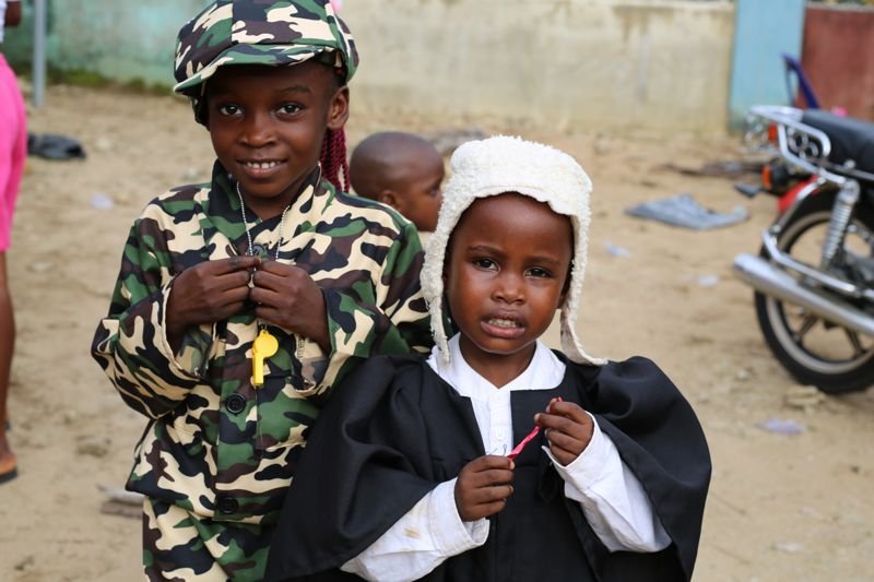 Pupils dressed as a soldier and a young graduate