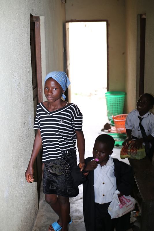 A pupil dressed as a nurse with a younger child