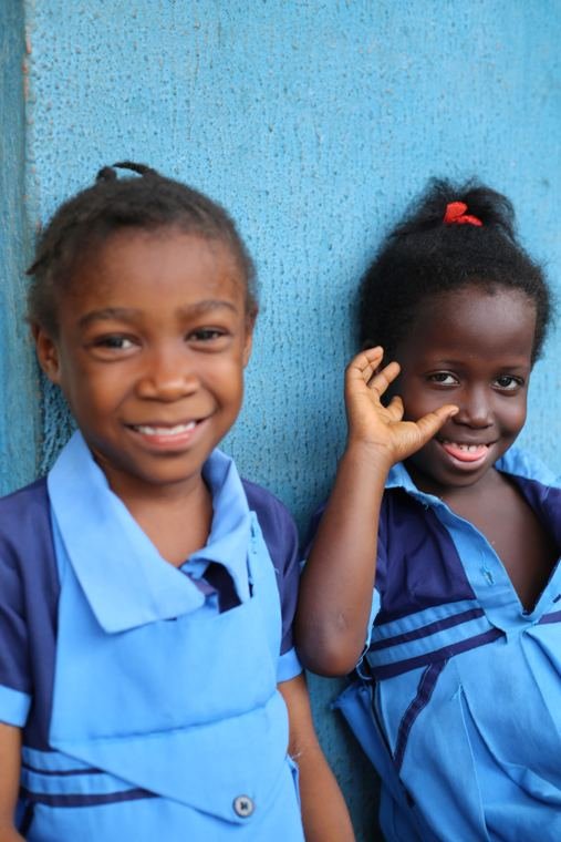 Two smiling pupils of Edoma Iyawot Academy